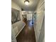 Inviting foyer with hardwood flooring and a bright white front door at 4910 Briarstone Ct, Raleigh, NC 27610