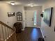Inviting foyer with hardwood flooring and a bright white front door at 4910 Briarstone Ct, Raleigh, NC 27610