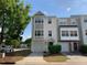 Charming townhome featuring a single-car garage and traditional architectural details at 4910 Briarstone Ct, Raleigh, NC 27610