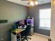 Home office with multiple monitors, a comfortable chair, and ample desk space at 4910 Briarstone Ct, Raleigh, NC 27610