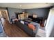Living room featuring hardwood flooring, sliding door, and neutral colored furniture at 4910 Briarstone Ct, Raleigh, NC 27610