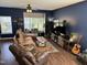Living Room featuring a large sectional, television, and plenty of decor at 4910 Briarstone Ct, Raleigh, NC 27610