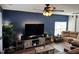 Comfortable living room with a mounted television and large sectional sofa at 4910 Briarstone Ct, Raleigh, NC 27610