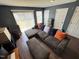 Living room with hardwood flooring, sliding door, and neutral colored furniture at 4910 Briarstone Ct, Raleigh, NC 27610