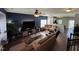 Spacious living room featuring a large TV, comfortable seating, and stylish decor at 4910 Briarstone Ct, Raleigh, NC 27610