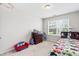Kid-friendly bedroom with a colorful bed, playful decor, and a basketball hoop for added fun at 513 Commons Dr, Holly Springs, NC 27540