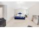 Bright bedroom featuring high ceilings, neutral paint, and plush carpeting for a serene retreat at 513 Commons Dr, Holly Springs, NC 27540