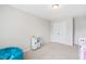 This ' bedroom offers a play area and a beanbag near a closet for storage at 513 Commons Dr, Holly Springs, NC 27540