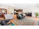 Open concept living room and kitchen area, perfect for entertaining with hardwood flooring and plenty of light at 513 Commons Dr, Holly Springs, NC 27540
