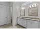 Bright bathroom features double vanities, granite countertops, and tile flooring at 5217 Beckom St, Raleigh, NC 27616