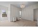 Bright bedroom with a view of the bathroom and two bedside tables at 5217 Beckom St, Raleigh, NC 27616