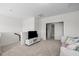 Cozy living room with neutral walls, plush carpet, and comfortable seating area perfect for relaxation at 5217 Beckom St, Raleigh, NC 27616
