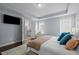 Spacious main bedroom features an ensuite bathroom and ample natural light at 5217 Beckom St, Raleigh, NC 27616