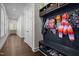 Mudroom with dark wood flooring, built-in shelving, and storage space at 5217 Beckom St, Raleigh, NC 27616