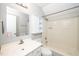 Bathroom featuring a shower-tub combo, toilet and vanity with storage at 5346 Deep River Rd, Sanford, NC 27330