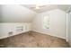 Neutral bedroom with a built in shelving unit, window, and ceiling fan at 5346 Deep River Rd, Sanford, NC 27330