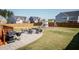A lovely backyard featuring a patio with a firepit, chairs, a grill, and a wooden playset at 536 Adkins Ridge Rd, Rolesville, NC 27571