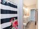 Tastefully designed bathroom featuring a double sink vanity, modern fixtures, and stylish black and white floral shower curtain at 536 Adkins Ridge Rd, Rolesville, NC 27571