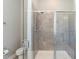 Modern bathroom featuring a glass-enclosed shower with tile surround, providing a clean and stylish design at 536 Adkins Ridge Rd, Rolesville, NC 27571