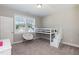 Well-lit bedroom with plush carpeting, a lofted bed and plenty of natural light at 536 Adkins Ridge Rd, Rolesville, NC 27571