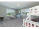 Bright bedroom with large windows, plush carpeting, and a charming chair at 536 Adkins Ridge Rd, Rolesville, NC 27571