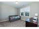 This cozy bedroom features neutral walls, plush carpeting, and a window providing natural light at 536 Adkins Ridge Rd, Rolesville, NC 27571