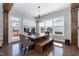 The light-filled dining area has a stylish table, chairs and a door to the backyard at 536 Adkins Ridge Rd, Rolesville, NC 27571