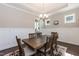 Dining room with a decorative chandelier, board and batten wainscoting, and stylish decor at 536 Adkins Ridge Rd, Rolesville, NC 27571