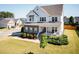 Charming two-story home boasts a welcoming front porch, beautiful landscaping, and a well-manicured lawn at 536 Adkins Ridge Rd, Rolesville, NC 27571
