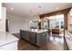 Open concept kitchen with granite countertops, stainless steel appliances, and hardwood floors at 536 Adkins Ridge Rd, Rolesville, NC 27571