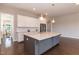 Kitchen island with a light countertop and stainless steel dishwasher at 536 Adkins Ridge Rd, Rolesville, NC 27571