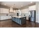 Open kitchen features sleek stainless steel appliances, ample cabinet space, and granite countertops at 536 Adkins Ridge Rd, Rolesville, NC 27571