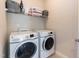 Convenient laundry room equipped with modern washer and dryer units and ample storage space at 536 Adkins Ridge Rd, Rolesville, NC 27571