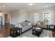 Comfortable living room featuring two sofas, dark wood tables and a patterned rug at 536 Adkins Ridge Rd, Rolesville, NC 27571