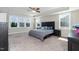 This large main bedroom features plush carpeting, neutral walls, and many windows at 536 Adkins Ridge Rd, Rolesville, NC 27571