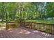 Back Deck featuring seating with an idyllic view of the backyard at 5414 Stanley Rd, Durham, NC 27704