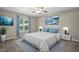 This bright primary bedroom features a ceiling fan, large window, and calming decor at 5414 Stanley Rd, Durham, NC 27704
