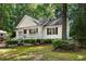 Charming one-story home with white siding and a landscaped yard at 5414 Stanley Rd, Durham, NC 27704