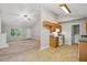 Open floor plan featuring the kitchen, range oven, and a view into the living room at 5414 Stanley Rd, Durham, NC 27704
