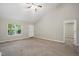 Bright living room with vaulted ceiling and carpet flooring at 5414 Stanley Rd, Durham, NC 27704
