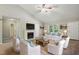 Bright living room with fireplace, vaulted ceiling, and comfortable seating arrangement at 5414 Stanley Rd, Durham, NC 27704