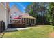 Spacious backyard featuring a deck, patio, and screened-in porch at 55 Fleming Forest Dr, Youngsville, NC 27596