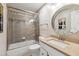 Bathroom with a tub and shower combo with glass doors, stylish tiles, and modern vanity at 55 Fleming Forest Dr, Youngsville, NC 27596