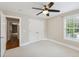 Bedroom with neutral paint, wall to wall carpeting, a ceiling fan, and ample natural light at 55 Fleming Forest Dr, Youngsville, NC 27596