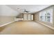 Large bonus room with a beverage bar, plenty of windows, and ample lighting at 55 Fleming Forest Dr, Youngsville, NC 27596