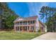 Charming two-story brick home with a covered front porch and well-manicured lawn at 55 Fleming Forest Dr, Youngsville, NC 27596