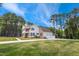 Spacious two-story home featuring a side-entry garage, manicured lawn, and a blend of brick and siding at 55 Fleming Forest Dr, Youngsville, NC 27596