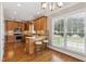 Bright eat-in kitchen featuring a center island, wooden cabinets, and stainless steel appliances at 55 Fleming Forest Dr, Youngsville, NC 27596