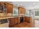 Spacious kitchen with stainless steel appliances, granite countertops, and wooden cabinets at 55 Fleming Forest Dr, Youngsville, NC 27596