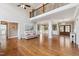 Spacious living room with high ceilings, hardwood floors, and views into the dining area and foyer at 55 Fleming Forest Dr, Youngsville, NC 27596